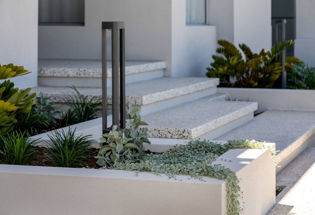Low maintenance landscaping at modern entrance