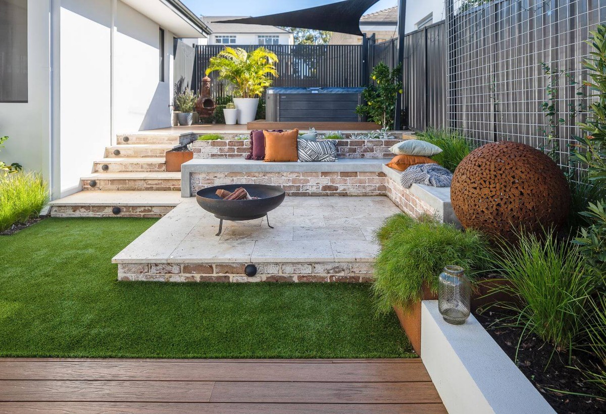 Tiered backyard landscaping with spa